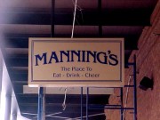 Sign installation New Orleans Manning’s Restaurant Fulton Street